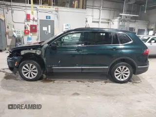 2018 Volkswagen Tiguan SEL with VIN 3VV2B7AX8JM113976, listed as a IAAI auction lot 42310576 with 100,319 mi miles and . Bid and sale history available at DreamBid. Image 14.