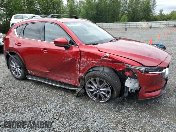 2019 Mazda CX-5 Grand Touring with VIN JM3KFBDM2K0639247, listed as a Copart auction lot 64060045 with 69,563 mi miles and Salvage title. Bid and sale history available at DreamBid. Image 4.