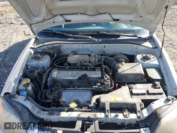 2005 Hyundai Accent GLS z VIN KMHCG45C25U623618, wystawiony jako IAAI lot #42140996 z przebiegiem 184 852 mil mil oraz . Historia ofert i sprzedaży dostępna na DreamBid. Obrazek 10.