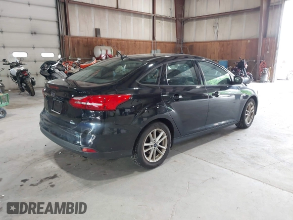 2018 Ford Focus SE with VIN 1FADP3FE8JL209560, listed as a IAAI auction lot 42707236 with 166,017 mi miles and . Bid and sale history available at DreamBid. Image 4.