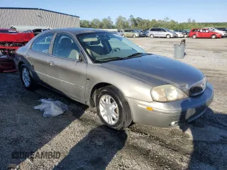 2004 Mercury Sable LS Premium with VIN 1MEHM55S84A614002, listed as a Copart auction lot 56582965 with 185,589 mi miles and Salvage title. Bid and sale history available at DreamBid. Image 4.