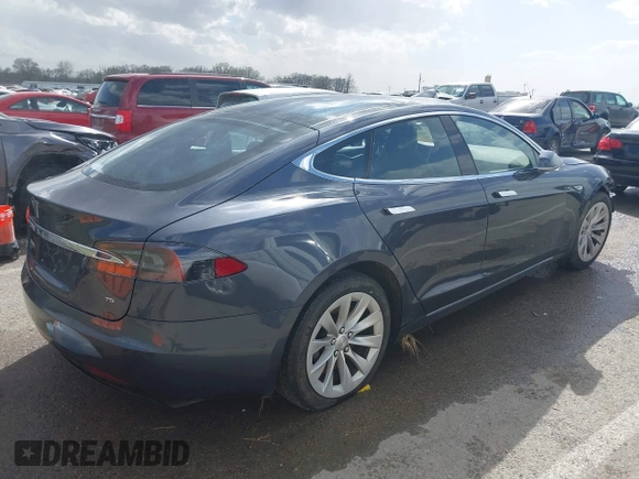 2016 Tesla Model S 70 with VIN 5YJSA1E14GF157118, listed as a IAAI auction lot 41794381 with 53,651 mi miles and . Bid and sale history available at DreamBid. Image 4.