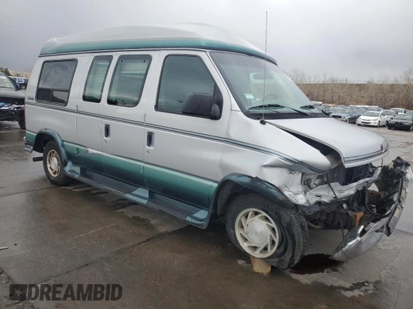 1999 Ford Econoline Cargo Recreational with VIN 1FDRE14L3XHA31771, listed as a Copart auction lot 49973795 with 220,268 mi miles and Salvage title. Bid and sale history available at DreamBid. Image 4.