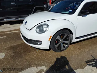 2012 Volkswagen Beetle 2.0T Turbo PZEV with VIN 3VW4A7AT6CM648540, listed as a IAAI auction lot 41326503 with 118,929 mi miles. Bid and sale history available at carsss.com. Image 2.
