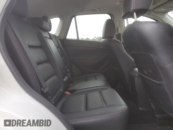 2014 Mazda CX-5 Grand Touring with VIN JM3KE4DY2E0354795, listed as a Copart auction lot 70713544 with 58,848 mi miles and Salvage Title. Bid and sale history available at DreamBid. Image 10.