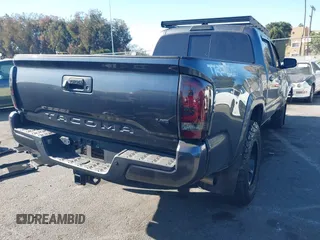 2021 Toyota Tacoma 4WD SR5 with VIN 3TMDZ5BNXMM107525, listed as a IAAI auction lot 41062698 with 41,771 mi miles. Bid and sale history available at carsss.com. Image 4.