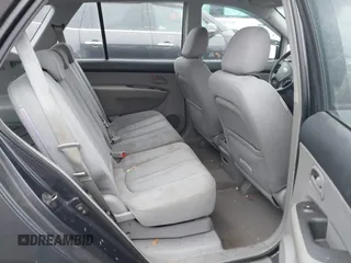 2007 Kia Rondo LX with VIN KNAFG525677081273, listed as a IAAI auction lot 42021437 with 191,413 mi miles. Bid and sale history available at carsss.com. Image 8.