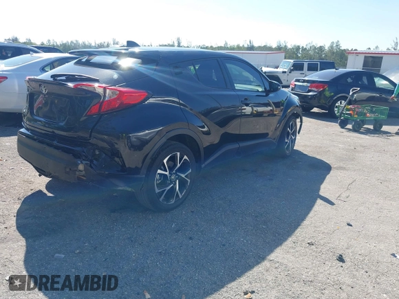 2021 Toyota C-HR LE with VIN NMTKHMBX7MR126165, listed as a IAAI auction lot 41848045 with 26,882 mi miles. Bid and sale history available at carsss.com. Image 4.