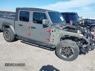 2021 Jeep Gladiator Willys with VIN 1C6HJTAG4ML517715, listed as a IAAI auction lot 41436634 with 21,187 mi miles and . Bid and sale history available at DreamBid. Image 1.