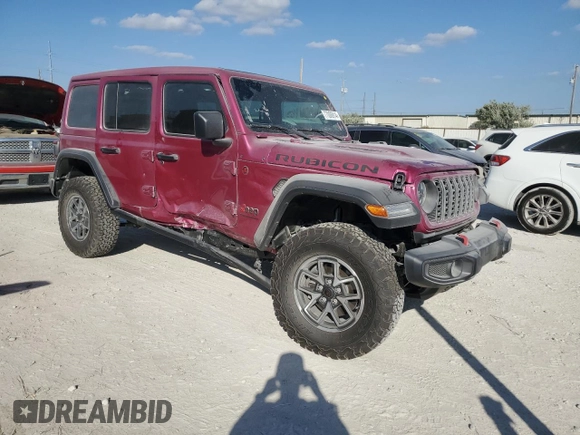 2024 Jeep Wrangler Rubicon with VIN 1C4PJXFG9RW346079, listed as a Copart auction lot 77006914 with 2,446 mi miles and Salvage Title. Bid and sale history available at DreamBid. Image 4.
