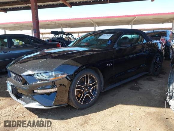 2019 Ford Mustang GT Premium z VIN 1FATP8FF7K5126175, wystawiony jako IAAI lot #42015019 z przebiegiem 91 335 mil mil oraz . Historia ofert i sprzedaży dostępna na DreamBid. Obrazek 17.