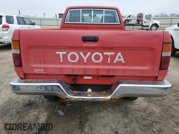 1991 Toyota Pickup DX z VIN JT4RN01P0M7042332, wystawiony jako Copart lot #42408835 z przebiegiem 211 481 mil mil oraz Szkoda całkowita • Salvage title. Historia ofert i sprzedaży dostępna na DreamBid. Obrazek 10.