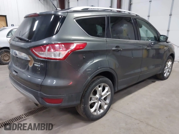 2016 Ford Escape Titanium with VIN 1FMCU9J90GUB35593, listed as a IAAI auction lot 42309020 with 173,019 mi miles and . Bid and sale history available at DreamBid. Image 4.