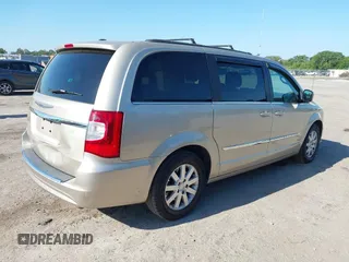 2014 Chrysler Town & Country Touring with VIN 2C4RC1BG4ER372629, listed as a IAAI auction lot 42060762 with 180,662 mi miles. Bid and sale history available at carsss.com. Image 4.