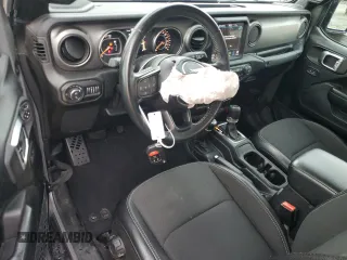 2021 Jeep Gladiator Sport S с VIN 1C6JJTAG1ML562354, выставлен на аукционе Copart как лот 54850185 с пробегом 67 473 миль миль и На запчасти • Non repairable. История ставок и продаж доступна на DreamBid. Изображение 8.