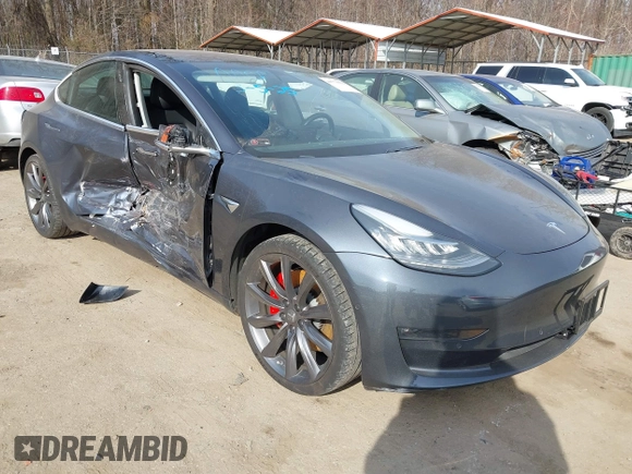 2018 Tesla Model 3 Long Range Battery with VIN 5YJ3E1EB5JF063077, listed as a IAAI auction lot 41773551 with 99,477 mi miles and . Bid and sale history available at DreamBid. Image 1.