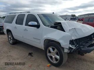 2014 Chevrolet Suburban LT with VIN 1GNSCJE02ER135926, listed as a IAAI auction lot 40675403 with 240,683 mi miles. Bid and sale history available at carsss.com. Image 1.
