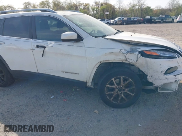 2015 Jeep Cherokee Latitude with VIN 1C4PJLCS6FW689607, listed as a IAAI auction lot 42103286 with 142,479 mi miles. Bid and sale history available at carsss.com. Image 6.