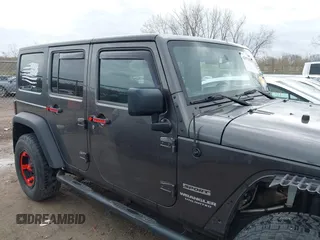 2014 Jeep Wrangler Unlimited Sport with VIN 1C4BJWDG6EL239378, listed as a IAAI auction lot 42073392 with 120,999 mi miles. Bid and sale history available at carsss.com. Image 14.