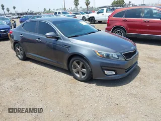 2015 Kia Optima LX z VIN KNAGM4A79F5621767, wystawiony jako IAAI lot #42477573 z przebiegiem 107 482 mil mil oraz . Historia ofert i sprzedaży dostępna na DreamBid. Obrazek 1.