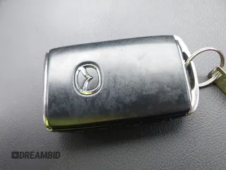 2022 Mazda 3 Carbon Edition z VIN 3MZBPACL7NM313242, wystawiony jako IAAI lot #42095279 z przebiegiem 30 787 mil mil oraz . Historia ofert i sprzedaży dostępna na DreamBid. Obrazek 11.