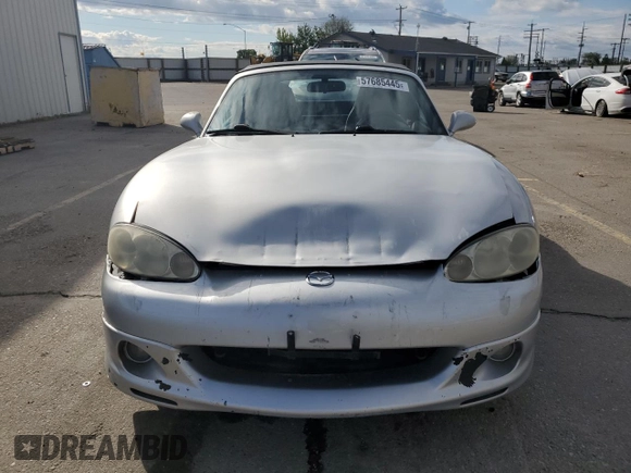 2003 Mazda MX-5 Miata Cloth z VIN JM1NB353X30311086, wystawiony jako Copart lot #57685445 z przebiegiem 141 634 mil mil oraz Szkoda całkowita • Salvage title. Historia ofert i sprzedaży dostępna na DreamBid. Obrazek 5.