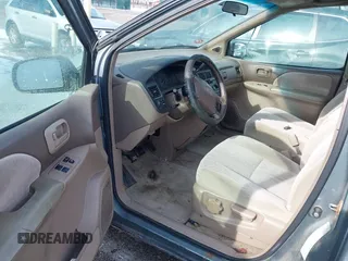 1999 Toyota Sienna LE with VIN 4T3ZF13C2XU118641, listed as a IAAI auction lot 41602097 with 261,792 mi miles. Bid and sale history available at carsss.com. Image 5.