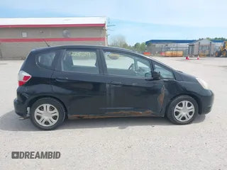 2009 Honda Fit z VIN JHMGE872X9S061071, wystawiony jako IAAI lot #42246291 z przebiegiem 225 991 mil mil oraz . Historia ofert i sprzedaży dostępna na DreamBid. Obrazek 14.