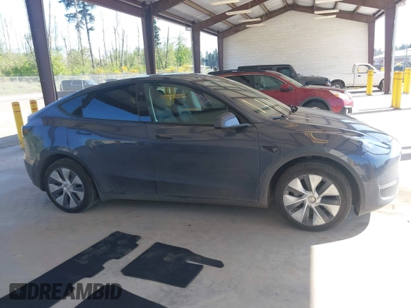 2023 Tesla Model Y Long Range with VIN 7SAYGAEE4PF906577, listed as a IAAI auction lot 42174987 with 13,260 mi miles and . Bid and sale history available at DreamBid. Image 13.