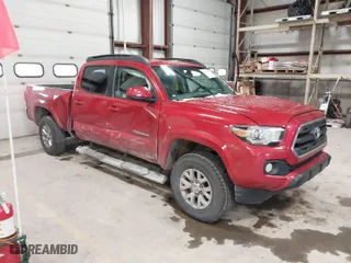 2017 Toyota Tacoma SR5 with VIN 5TFDZ5BN8HX018651, listed as a IAAI auction lot 41239996 with 124,418 mi miles. Bid and sale history available at carsss.com. Image 1.
