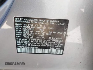 2023 Volkswagen Atlas SE z VIN 1V2JR2CA4PC526973, wystawiony jako IAAI lot #41712167 z przebiegiem 77 370 mil mil oraz . Historia ofert i sprzedaży dostępna na DreamBid. Obrazek 9.