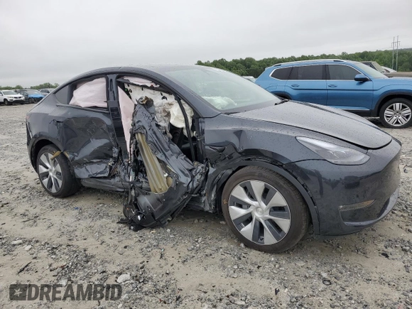 2024 Tesla Model Y Long Range with VIN 7SAYGAEE7RF005786, listed as a Copart auction lot 58415195 with 8,700 mi miles and Salvage title. Bid and sale history available at DreamBid. Image 4.