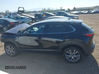 2022 Mazda CX-30 S Premium with VIN 3MVDMBDL6NM407913, listed as a IAAI auction lot 42359860 with 35,804 mi miles and . Bid and sale history available at DreamBid. Image 15.