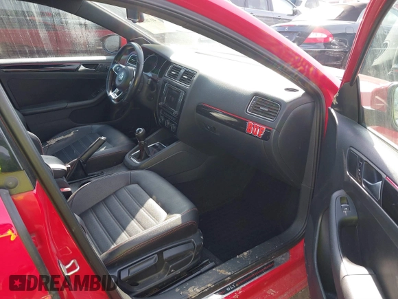 2016 Volkswagen Jetta Sedan 2.0T GLI SE with VIN 3VW5T7AJ0GM357177, listed as a IAAI auction lot 41769034 with 127,324 mi miles. Bid and sale history available at carsss.com. Image 5.