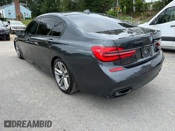 2019 BMW 7 Series 740i xDrive with VIN WBA7E4C55KGV28722, listed as a Copart auction lot 64955445 with 94,901 mi miles and Clean title. Bid and sale history available at DreamBid. Image 2.