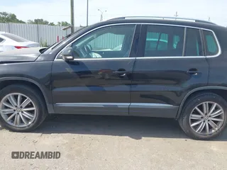 2012 Volkswagen Tiguan SE with VIN WVGAV7AX6CW521960, listed as a IAAI auction lot 42249355 with 118,496 mi miles and . Bid and sale history available at DreamBid. Image 14.