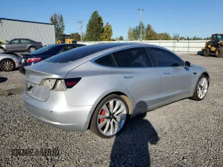 2018 Tesla Model 3 Long Range Battery with VIN 5YJ3E1EB4JF074295, listed as a Copart auction lot 74775384 with 83,515 mi miles and Salvage Title. Bid and sale history available at DreamBid. Image 3.