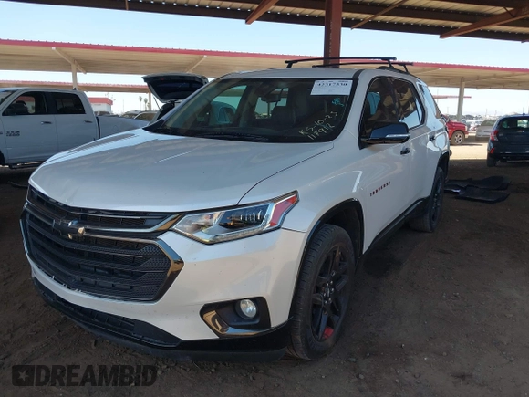 2020 Chevrolet Traverse Premier with VIN 1GNERKKW3LJ117912, listed as a IAAI auction lot 42317330 with 113,576 mi miles and . Bid and sale history available at DreamBid. Image 2.