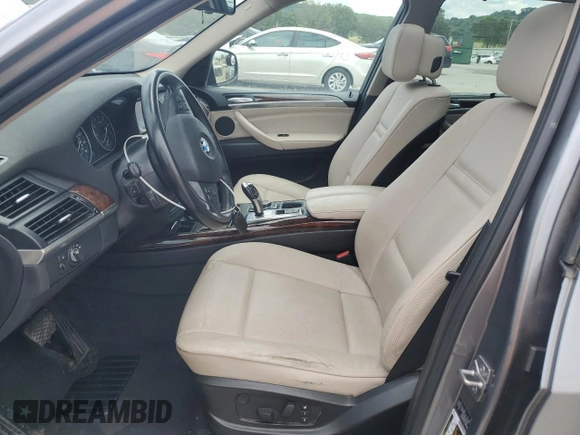 2012 BMW X5 35i with VIN 5UXZV4C59CL991689, listed as a Copart auction lot 64022615 with 208,620 mi miles and Salvage title. Bid and sale history available at DreamBid. Image 7.