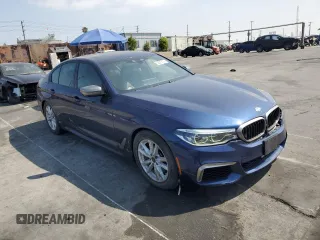 2019 BMW 5 Series M550i xDrive with VIN WBAJB9C51KB464722, listed as a Copart auction lot 53575135 with 70,187 mi miles and Salvage title. Bid and sale history available at DreamBid. Image 4.