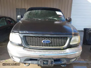 2000 Ford F-150 XL with VIN 1FTRX18LXYNA19385, listed as a IAAI auction lot 41075391 with 214,624 mi miles. Bid and sale history available at carsss.com. Image 6.