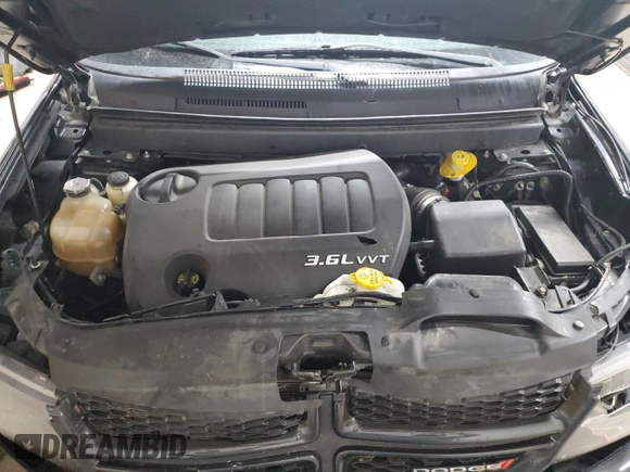 2013 Dodge Journey Crew with VIN 3C4PDCCG4DT693869, listed as a Copart auction lot 63666684 with 134,424 mi miles and Salvage title. Bid and sale history available at DreamBid. Image 12.