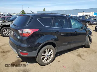 2017 Ford Escape SE z VIN 1FMCU0GD5HUD52467, wystawiony jako Copart lot #70616944 z przebiegiem 115 876 mil mil oraz Szkoda całkowita • Salvage title. Historia ofert i sprzedaży dostępna na DreamBid. Obrazek 3.