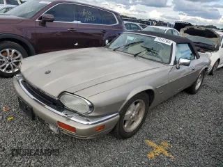 1995 Jaguar XJS with VIN SAJNX2747SC196723, listed as a Copart auction lot 74147364 with 70,138 mi miles and Salvage Title. Bid and sale history available at carsss.com. Image 1.