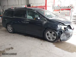 2011 Honda Odyssey Touring with VIN 5FNRL5H93BB070451, listed as a IAAI auction lot 41588240 with 231,248 mi miles. Bid and sale history available at carsss.com. Image 1.
