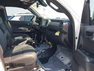 2023 Toyota Tacoma SR with VIN 3TMCZ5AN7PM630874, listed as a IAAI auction lot 40298041 with 8,635 mi miles and . Bid and sale history available at DreamBid. Image 5.