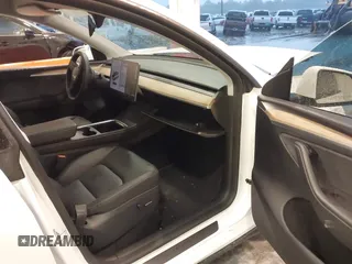 2023 Tesla Model Y Long Range with VIN 7SAYGDEE3PA206757, listed as a IAAI auction lot 39425483 with 5,711 mi miles and . Bid and sale history available at DreamBid. Image 5.