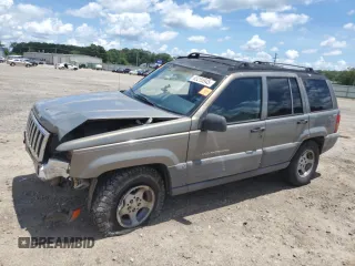 1997 Jeep Grand Cherokee Laredo with VIN 1J4GZ58S7VC505069, listed as a Copart auction lot 63255945 with 127,552 mi miles and Salvage title. Bid and sale history available at DreamBid. Image 1.