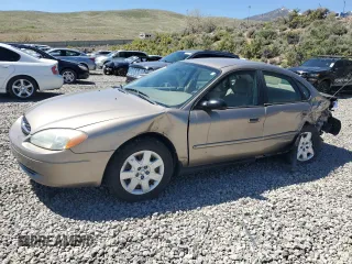 2003 Ford Taurus LX Standard z VIN 1FAFP52U63G277370, wystawiony jako Copart lot #56184345 z przebiegiem 115 778 mil mil oraz Szkoda całkowita • Salvage title. Historia ofert i sprzedaży dostępna na DreamBid. Obrazek 1.