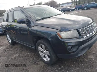 2014 Jeep Compass Latitude with VIN 1C4NJCEB2ED859539, listed as a IAAI auction lot 41809569 with 192,384 mi miles. Bid and sale history available at carsss.com. Image 1.
